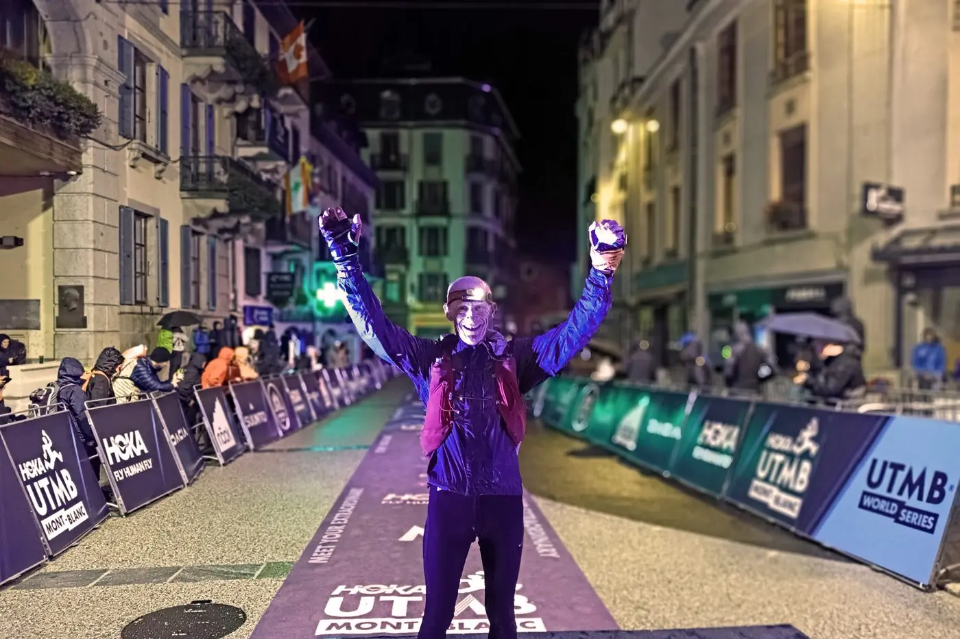 CHAMPION: Cooma athlete, Mick Sullivan, celebrates as he crosses the line of the gruelling UTMB 100km race in first place for his age category. PHOTO: Paul Brechu