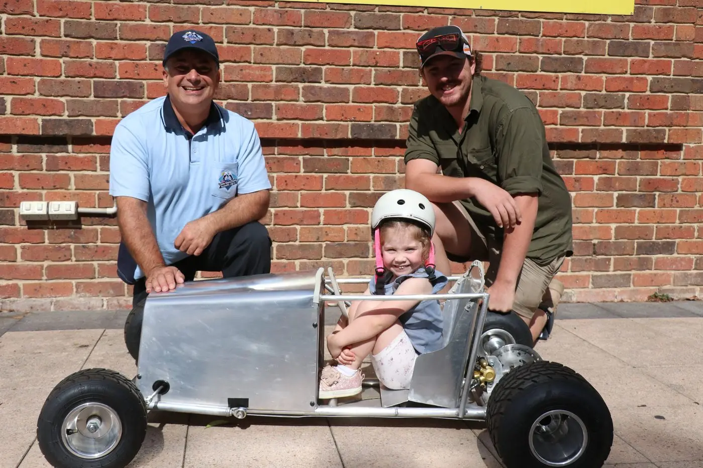 RACING: The Monaro Billy Cart Derby is set for one of its biggest events yet on Sunday. Organisers Tony Nassar (left), Kurt Wassink (right) and little Anna are looking forward to the derby. PHOTO: Nathan Thompson