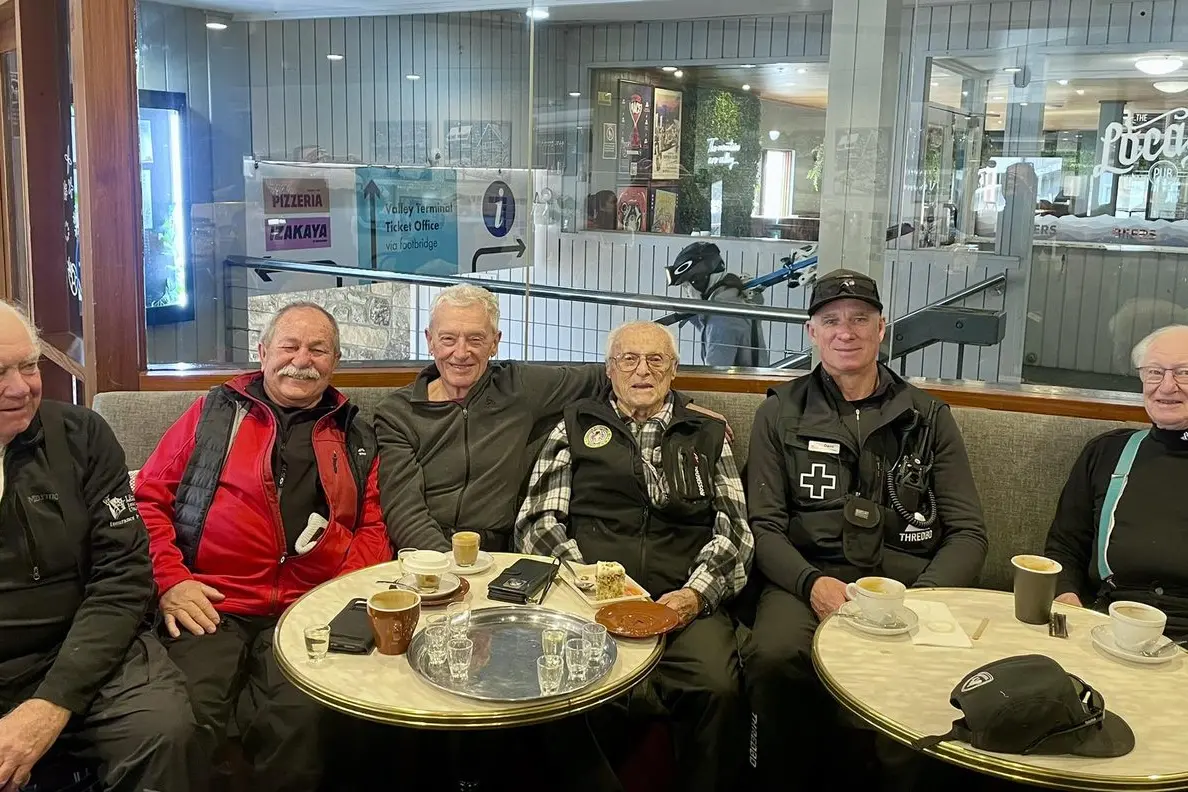 ICON: Thredbo legend, Tommy Tomasi (centre) celebrates his 99th birthday with friends. PHOTO: Supplied