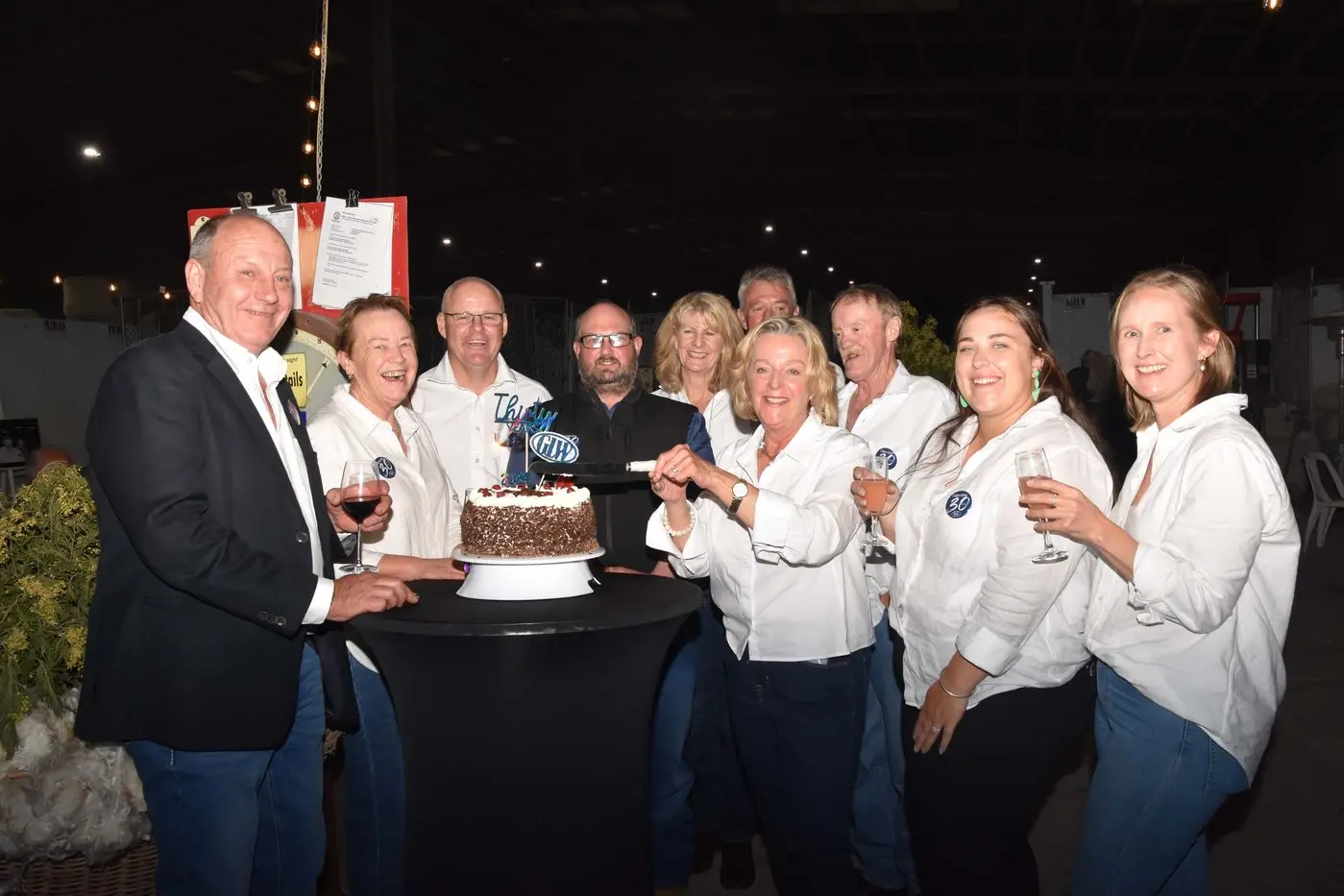 CHEERS: The team at Gordon Litchfield Wool celebrate 30-years of business. Gordon (far left) and Kate Litchfield (centre) say trust is key in business. PHOTO: Gordon Litchfield Wool