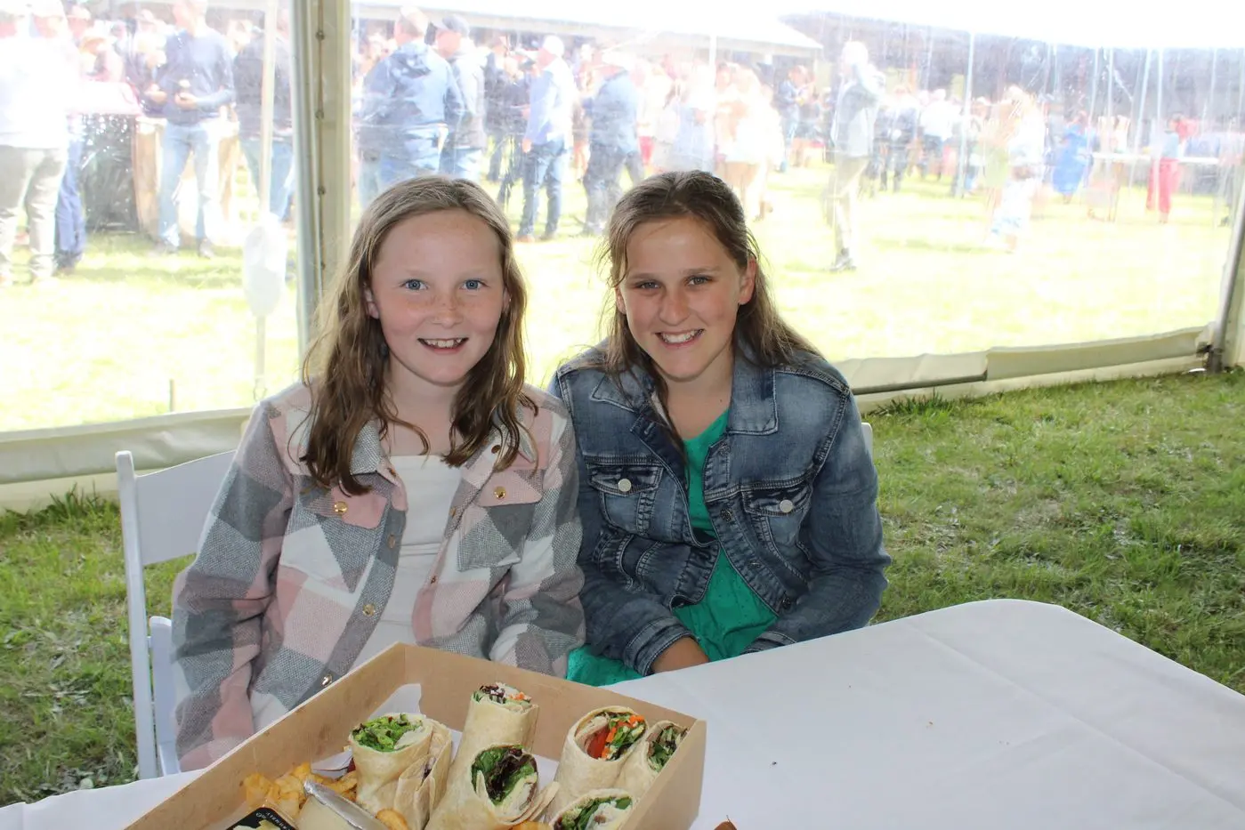 SOCIAL: Bombala girls Harper Stewart and April Kimber, in the marquee at Bombala races last year. PHOTOS: Monaro Post