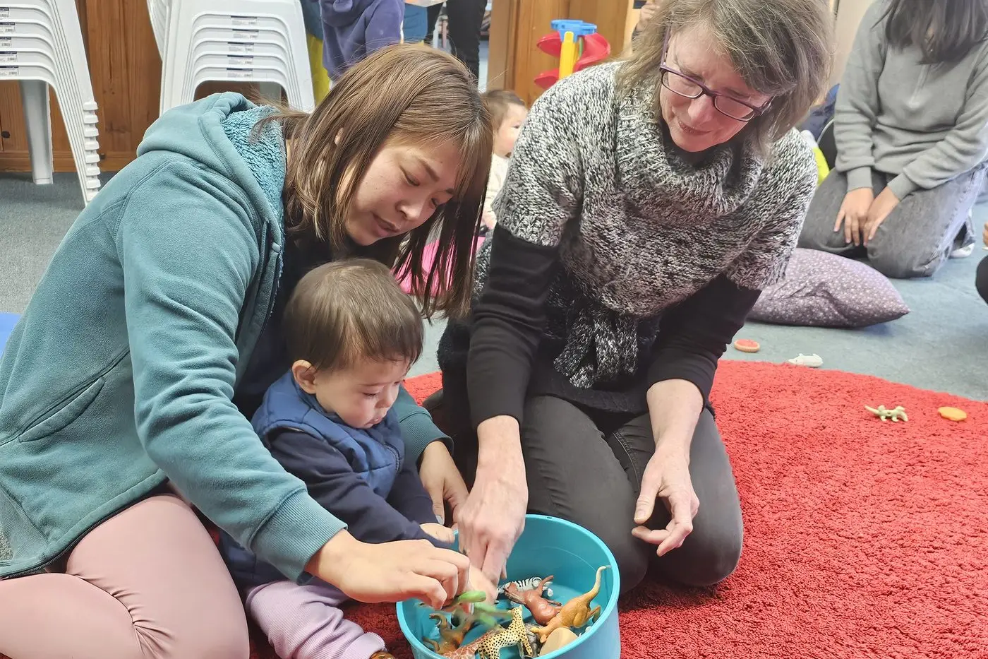 TOGETHER: Cooma Multicultural Centre manager Yvi Henderson (right) helps host the popular Mother Goose program at the centre each week. Yuri and son Lenny enjoy attending and making connections through the program. PHOTO: Karen Forman