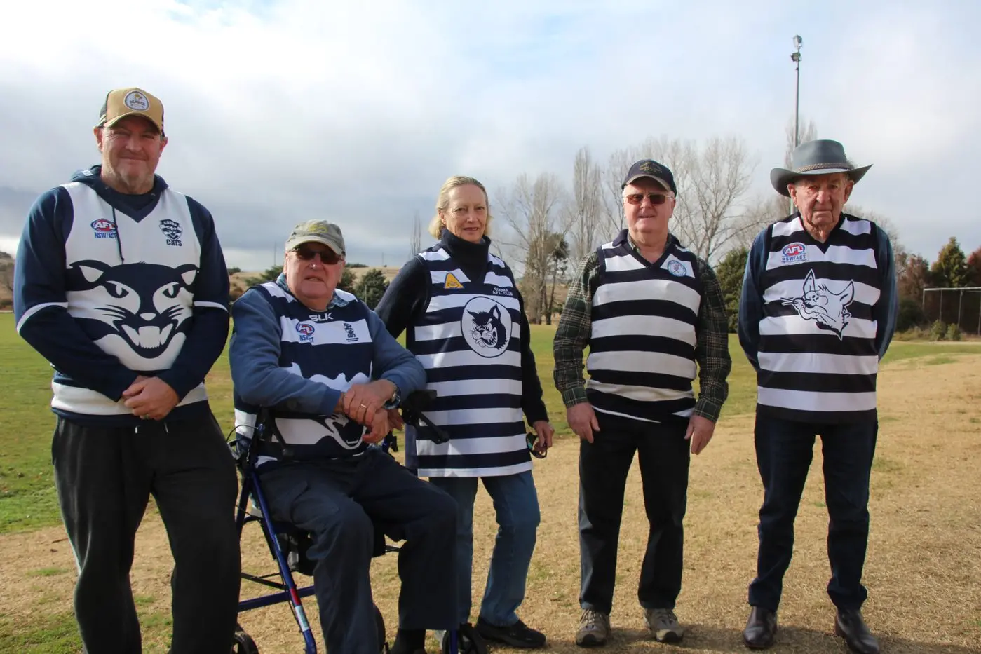 CELEBRATION: Current Southern Cats/Cooma Cats volunteer and club life member Damien Asanovski, 1976 captain Max Reeve, Gail Eastaway OAM former club secretary and publicity officer, Rihcard Upton former player and Kevin Jackson, former trainer and strapper are all looking forward to the Cats 1984 premiership reunion on Saturday at Snowy Oval. PHOTOS: Nathan Thompson