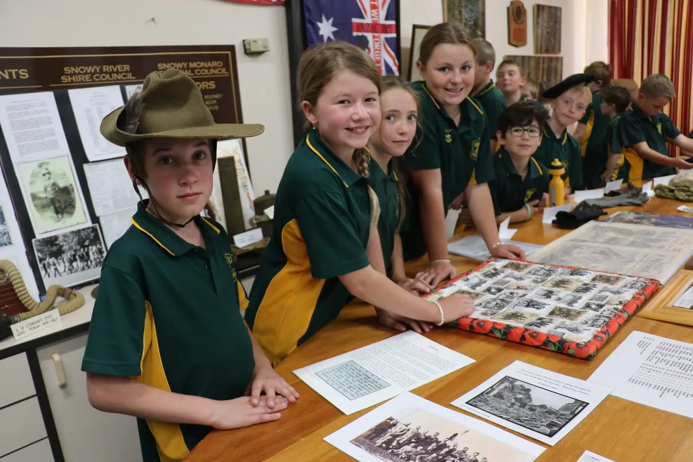 HISTORY: Blaine, Mila, Isla, Ava, Henry, Brian, Zac and classmates take a look at some of the information presented at the military exhibition held at Council\\'s Berridale office last week. PHOTOS: Melinda Cairns Hack