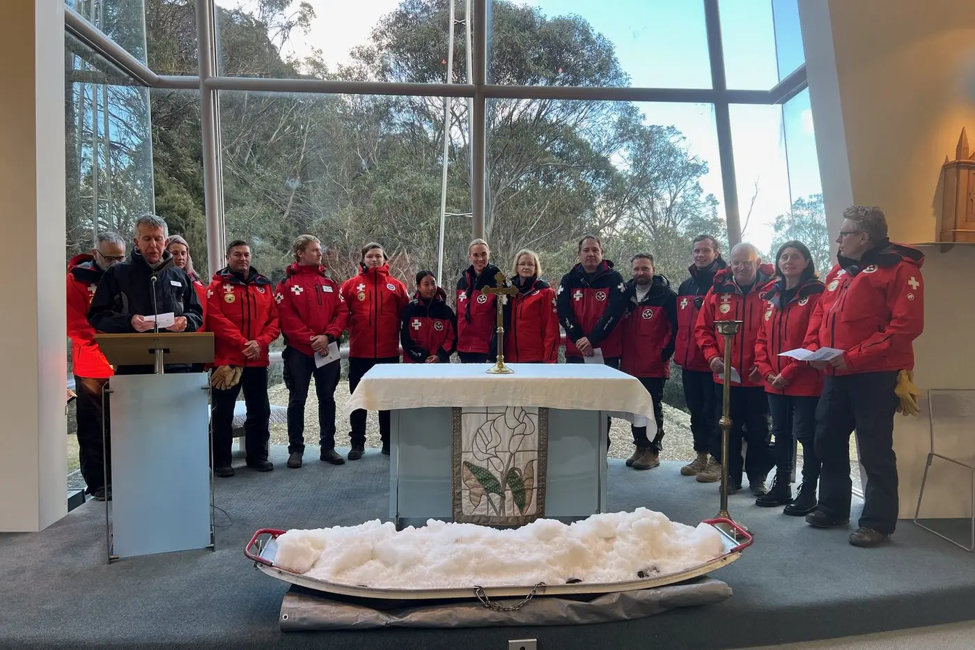 SERVICE: Chaplain Graham Morrison with Thredbo Ski Patrol members at the Thredbo Blessing of the Snow service on Sunday.