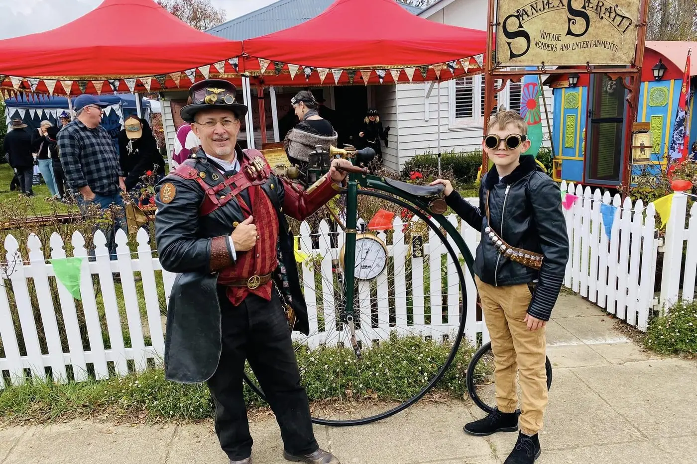 STEAMPUNK: A favourite each year at Nimmitabel\\'s SteamPunk @ Altitude is Sanjex Serrati (left). Sanjex is joined in 2023 by a Steampunk visitor, eager to inspect Sanjex\\'s penny-farthing. PHOTO: Vee Jay