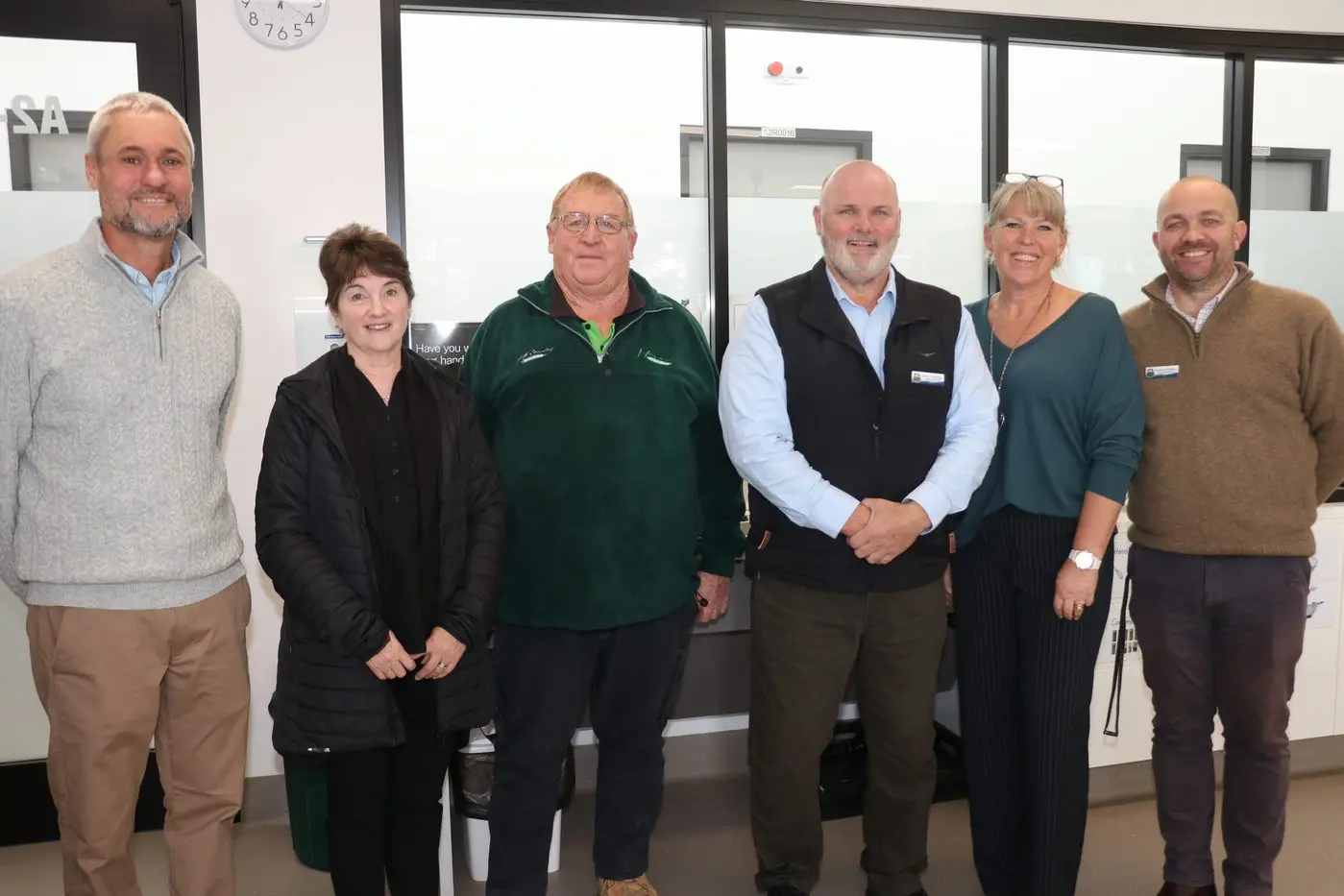 COMMUNITY SPIRIT: Monaro Milk proprietors, Debbie and Michael Johnson with deputy principal, Nathan Schubert, (far right), principal James Armitage (third from right), and special education teachers, Leanne Wiggins (second right) and Troy McNab (far left).PHOTOS: Melinda Cairns Hack