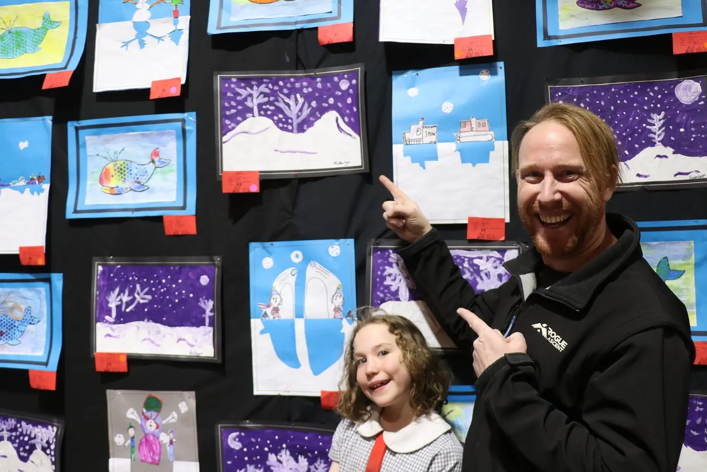 ARTIST: Cooma North Public School student, Makailyn, shows her dad, Laurent, her snowscape artwork. PHOTOS: Nathan Thompson