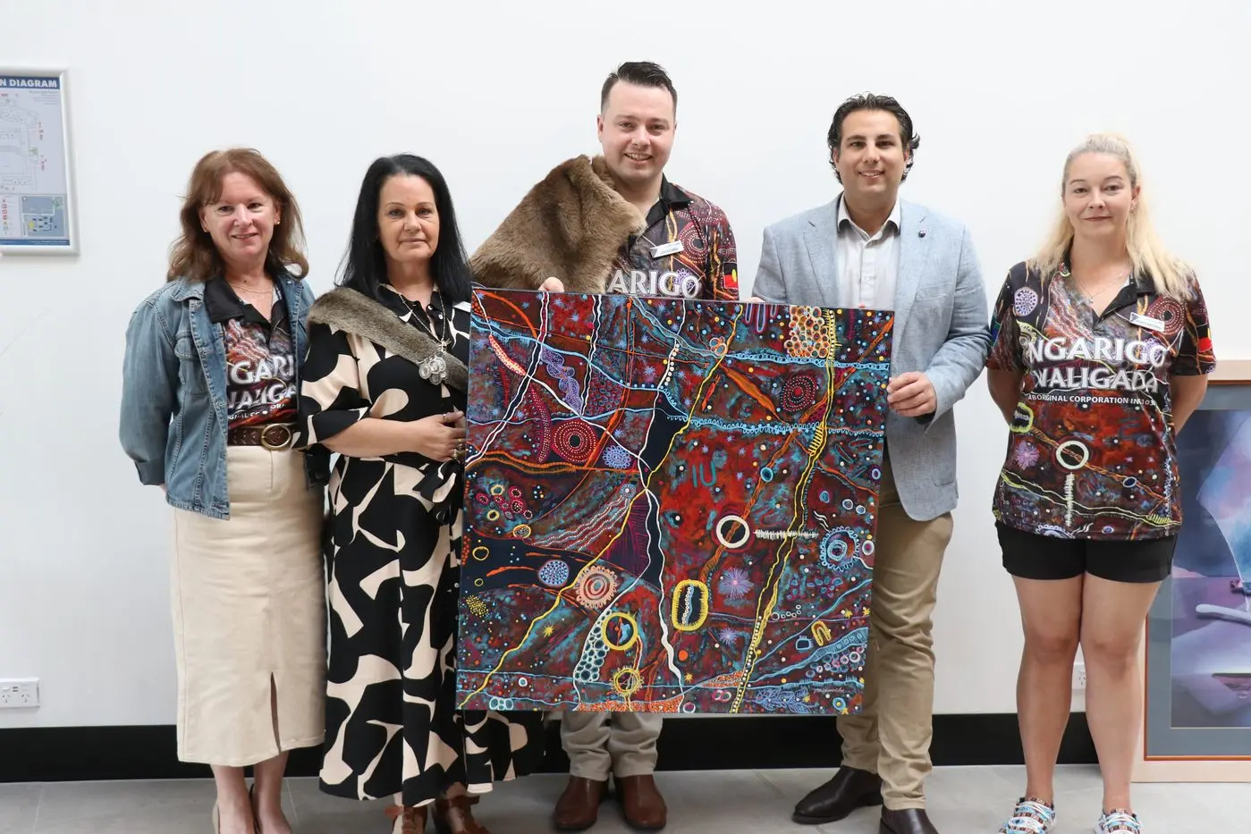 HAND OVER: Cindy Chawner, (left), Aunty Tammy Wilesmith, Uncle Mike Wilesmith, and Aunty Rachael Hopkins present Snowy Monaro Regional Council mayor, Clr Chris Hanna, with art for his office.