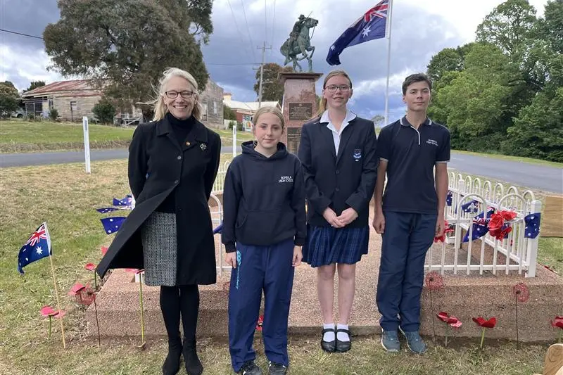 <p>HONOUR: Bombala High School students, Emily, Lola and Cooper join Dr Pip Ryan of the Delegate RSL Sub-branch at the Delegate service. PHOTO: Supplied</p>\\n