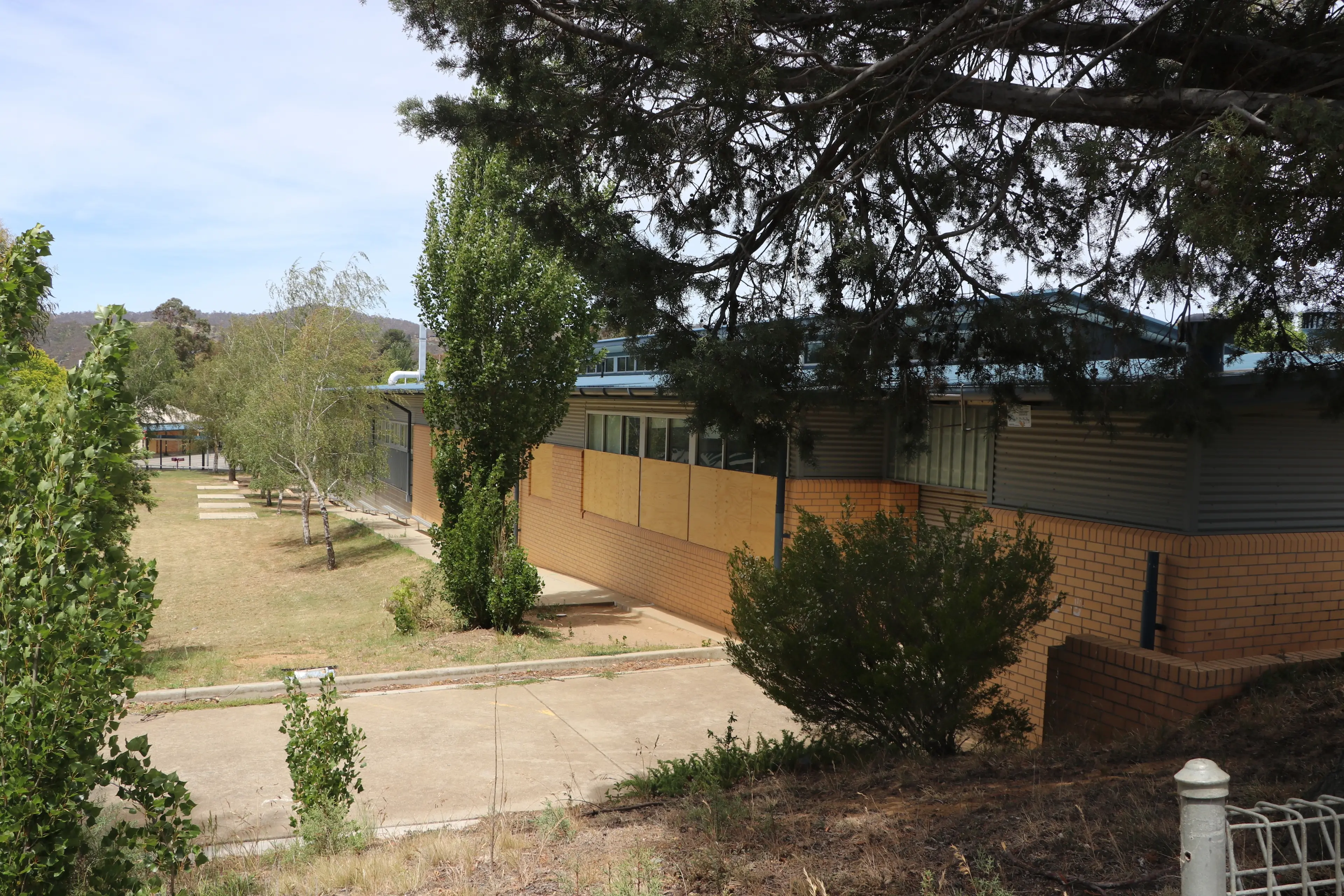 <p>DAMAGED: The former Jindabyne Central School site is boarded up to prevent further vandalism. PHOTOS: Contributed</p>\\n