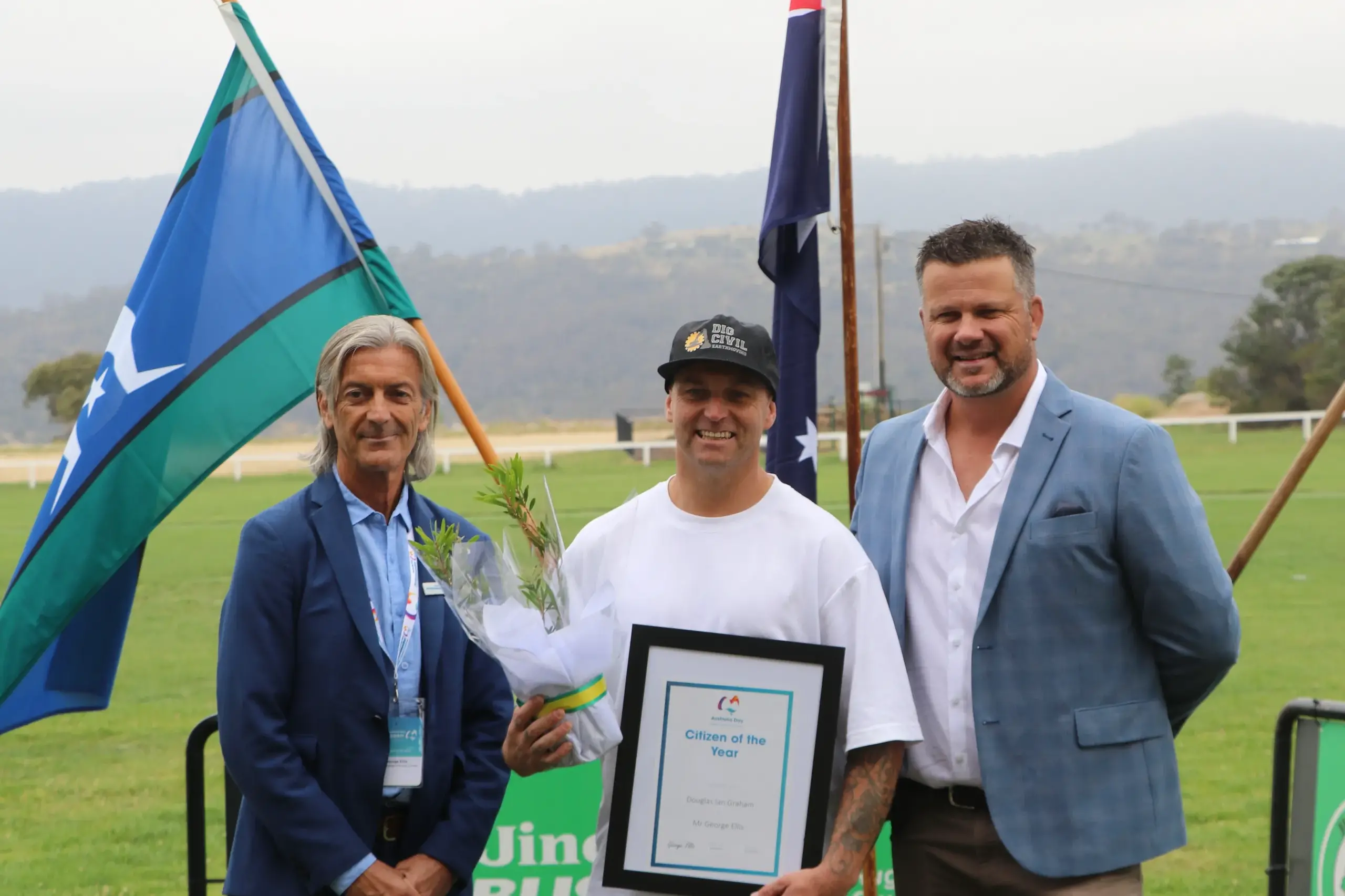 <p>CEREMONY: The 2026 Jindabyne Australia Day Citizen of the Year awarded to Dougie Graham, presented by Australia Day ambassador George Ellis and event host Matt Trippet. PHOTOS: Trista Heath</p>\\n
