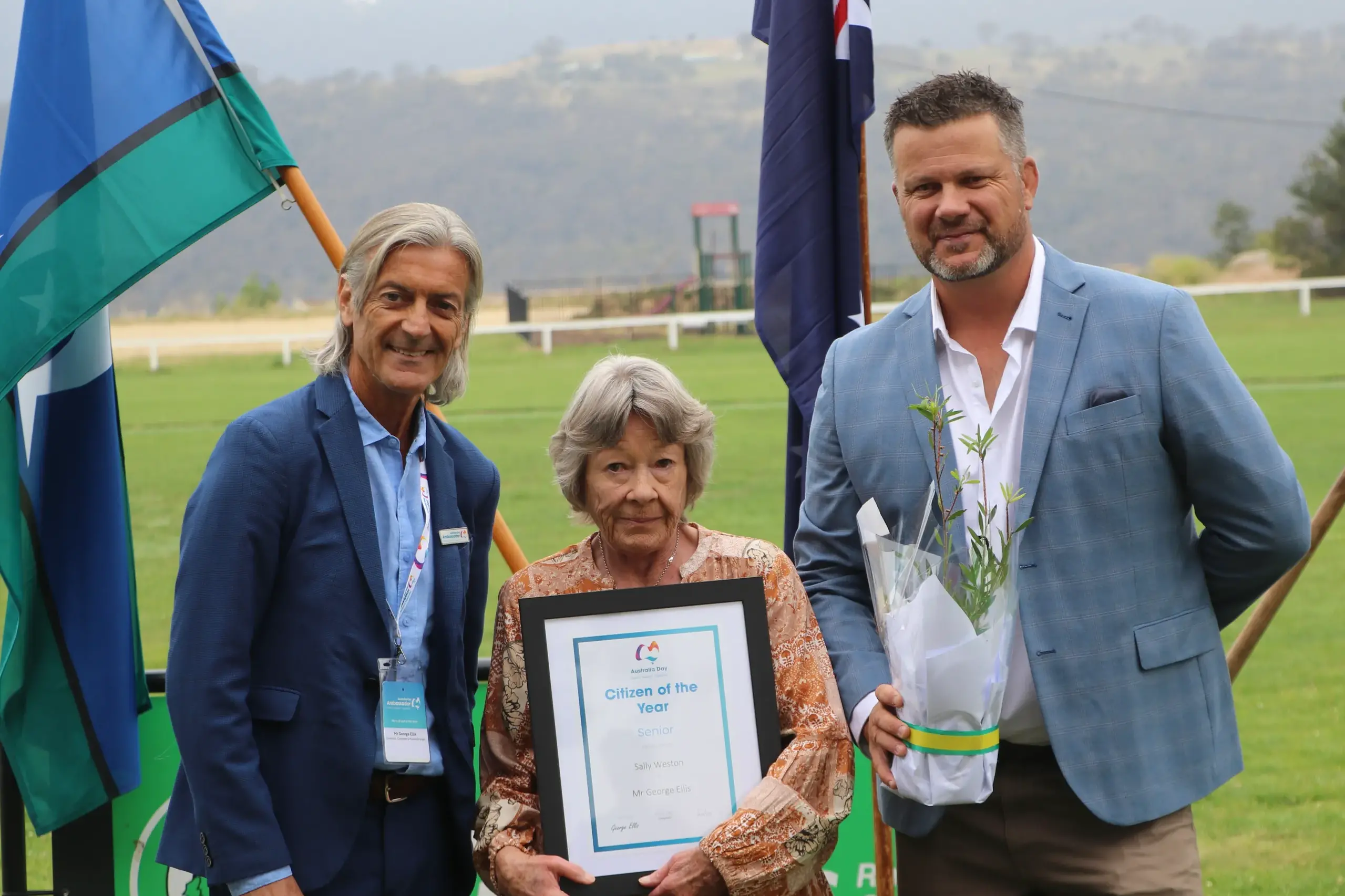 <p>HONOURED: Australia Day ambassador, George Elis presents the 2026 Jindabyne Senior Citizen of the Year award to Sally Weston, alongside event host Matt Tripet. PHOTO: Trista Heath</p>\\n