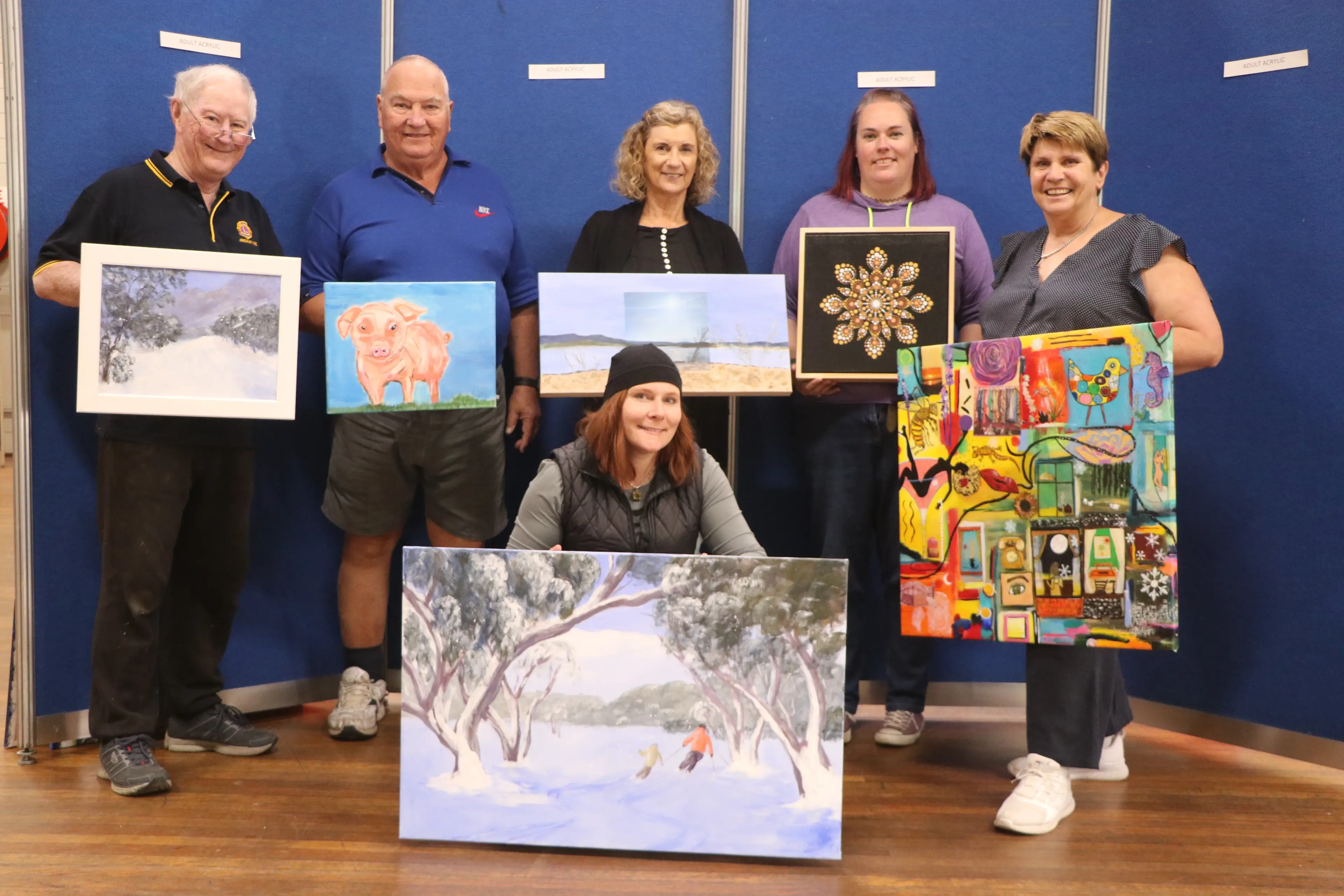 <p>ARTSY: Jindabyne Lions Club Easter Art Show and Sale committee getting ready for last year\\u2019s show. PHOTOS: Trista Heath</p>\\n