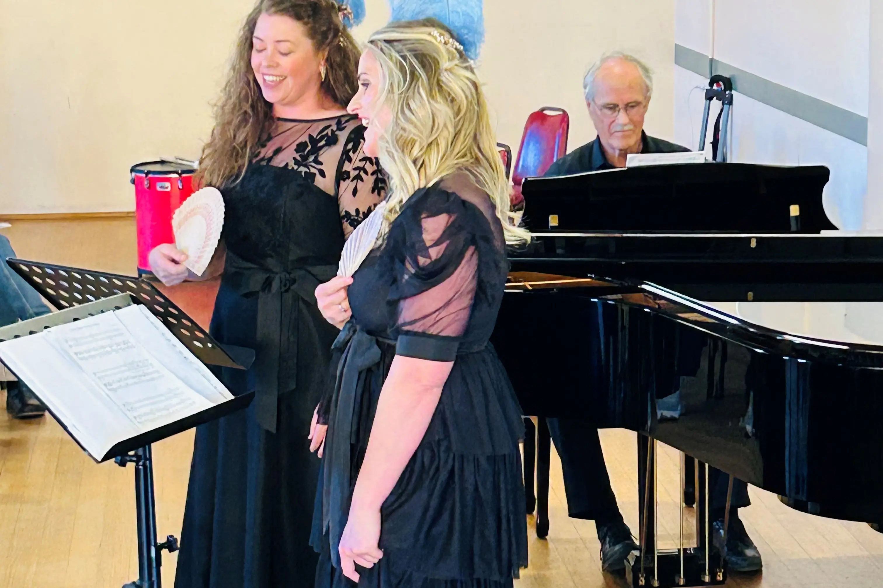 <p>TALENT: Alex Strudwick (back) and Julia Horneman (front) wow the Cooma crowd with their singing. Phil Horneman is on piano. PHOTO: Supplied</p>\\n