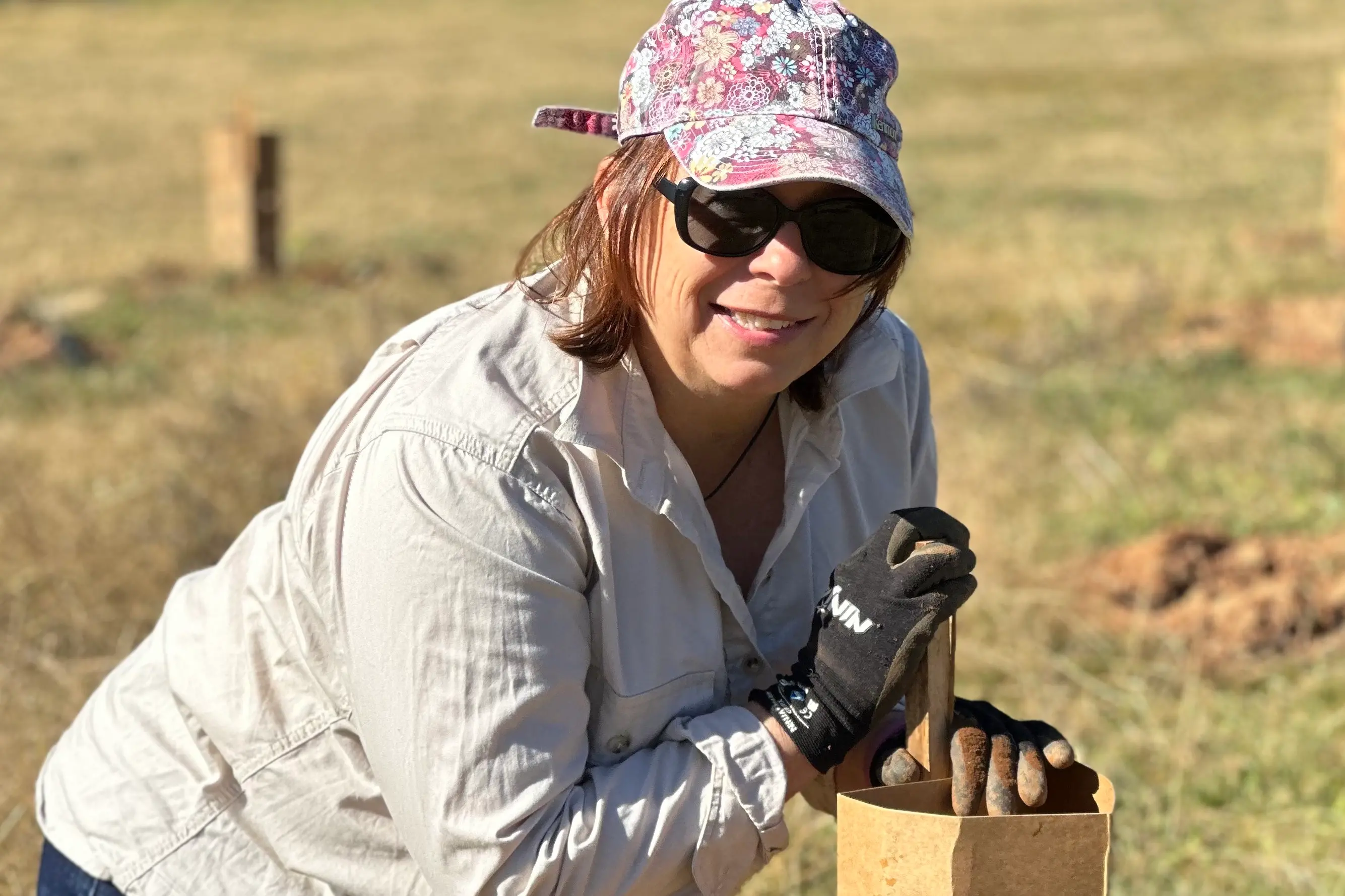 <p>CARE: Numeralla\\'s Ann Henkel plants a koala habitat tree at the recent community day. PHOTO: Supplied</p>\\n